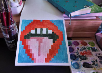 photo of pixel watercolor sketchbook on page 13, a pixel drawing of an open mouth with its tongue sticking out
