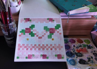 photo of pixel watercolor sketchbook on page 17, a pixel pattern inspired by a pink floral vintage cake